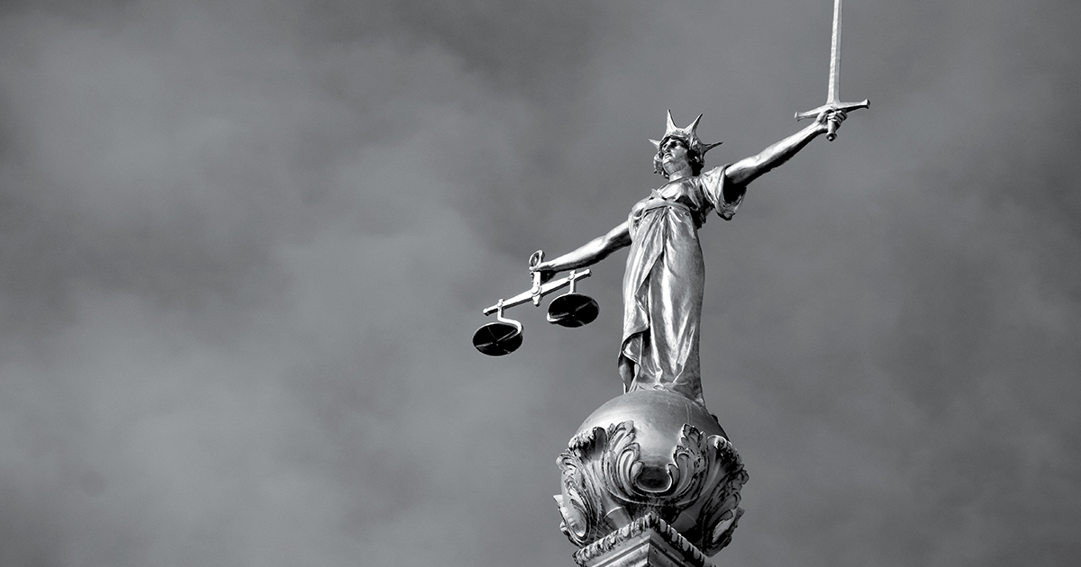 Image showing a statue of lady justice hodling up scales and a sword