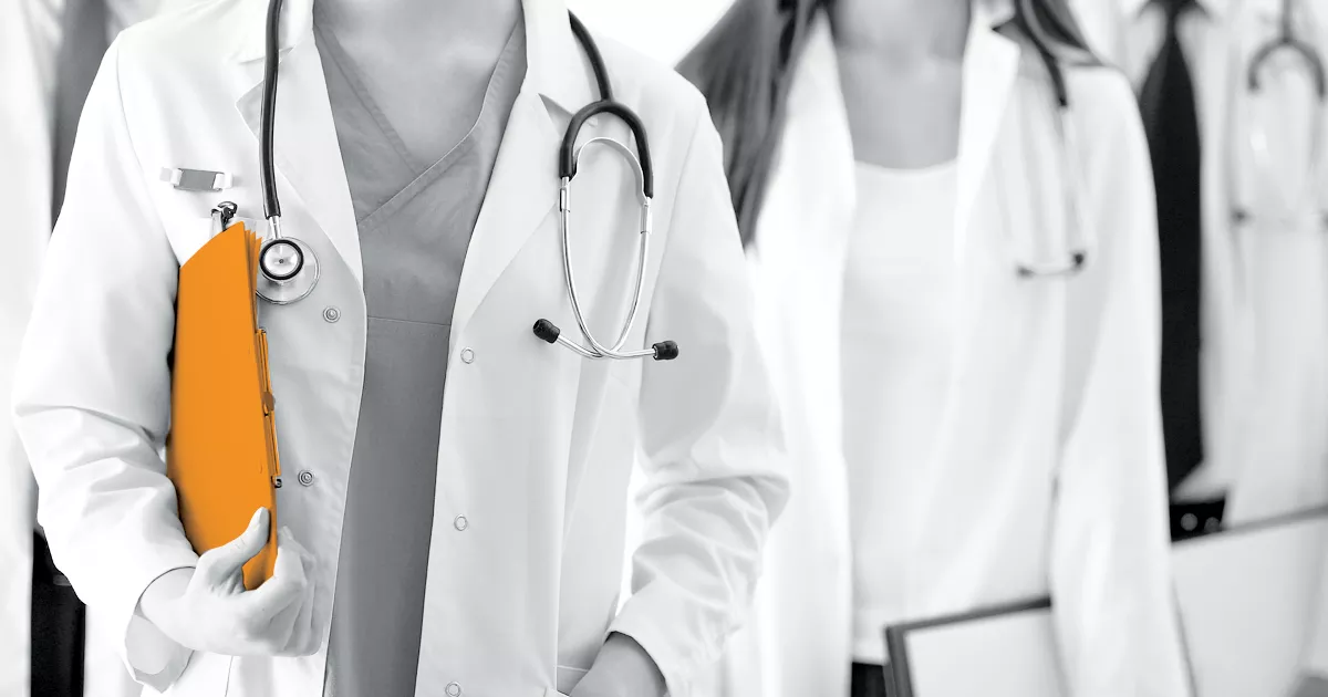 Image showinga group of NHS staff wearing lab coats
