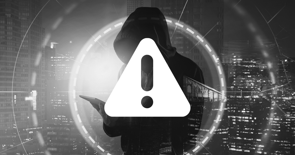 Image showing a warning symbole infront of a hooded figure