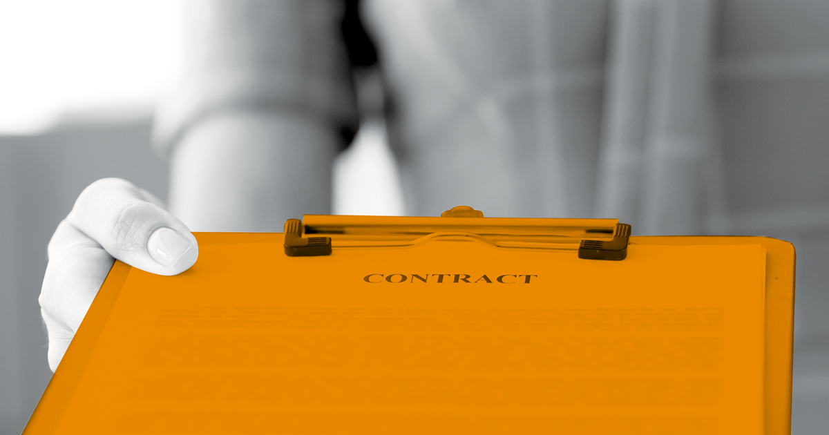 Image showing a contract in a clip boad being handed over