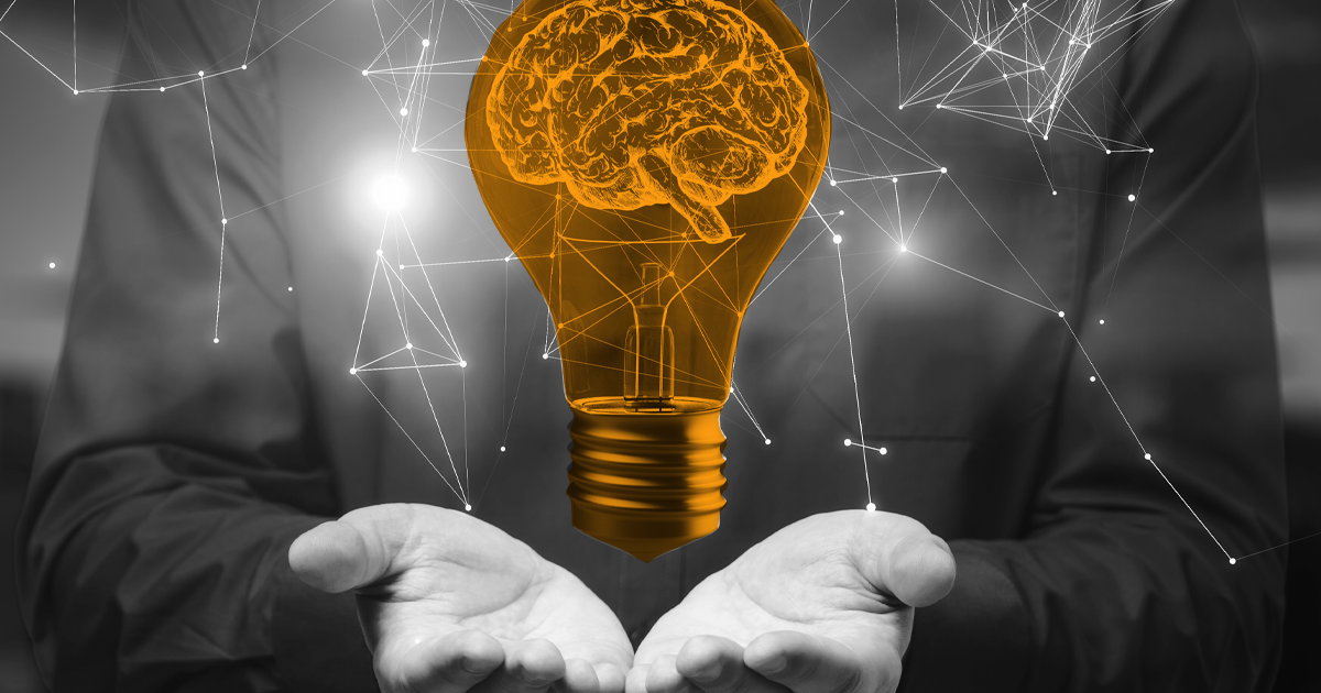 Image showing a person holding out their hands, floating above their hands is an orange lightbulb with the image of a brain inside.