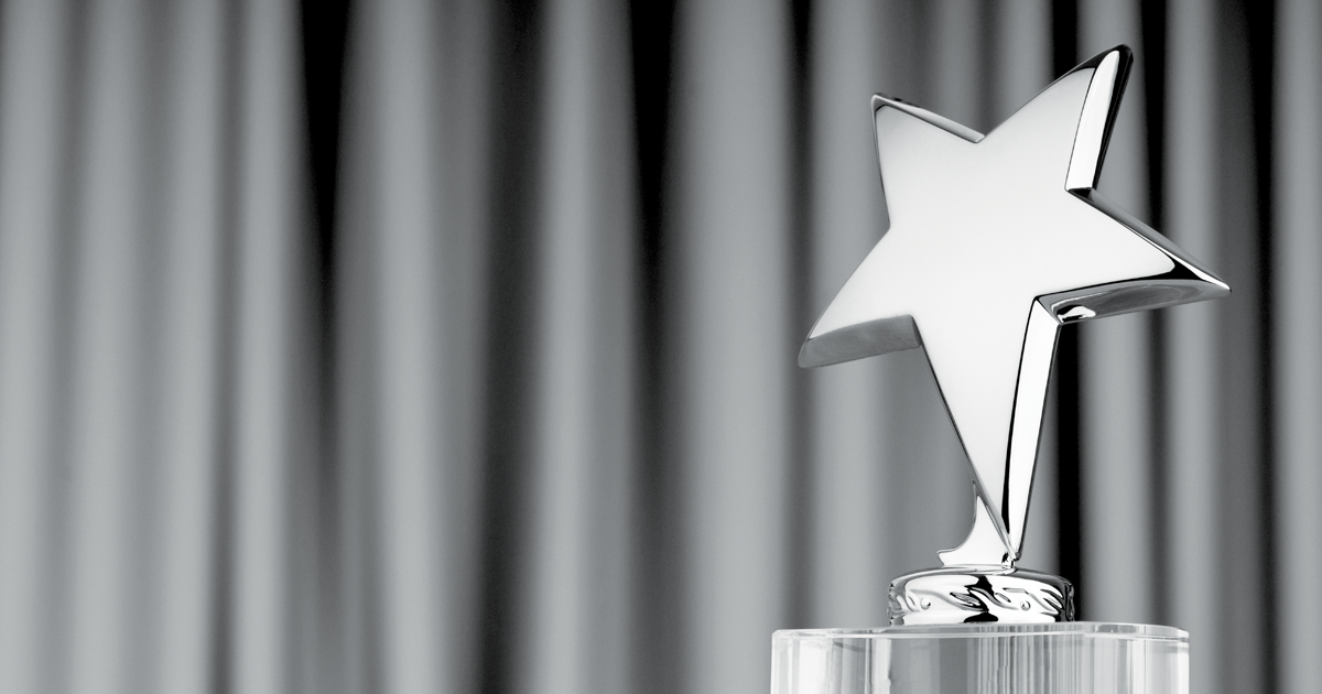 Image of black and white trophy in the shape of a star