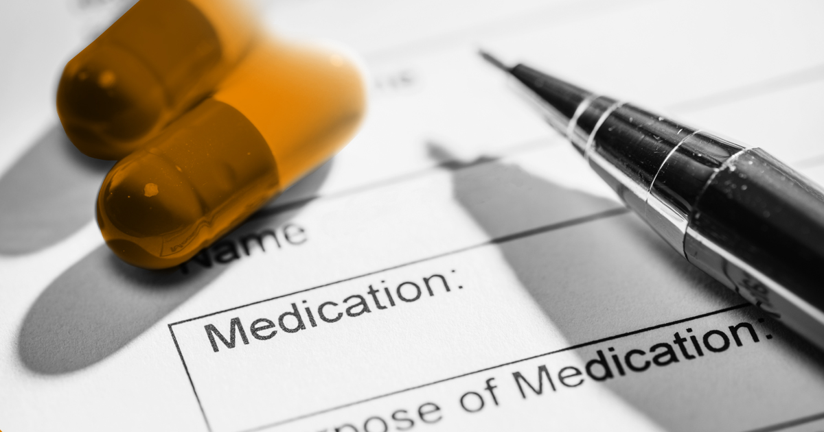 Image showing two tables sitting on top of a from with the word medication visable