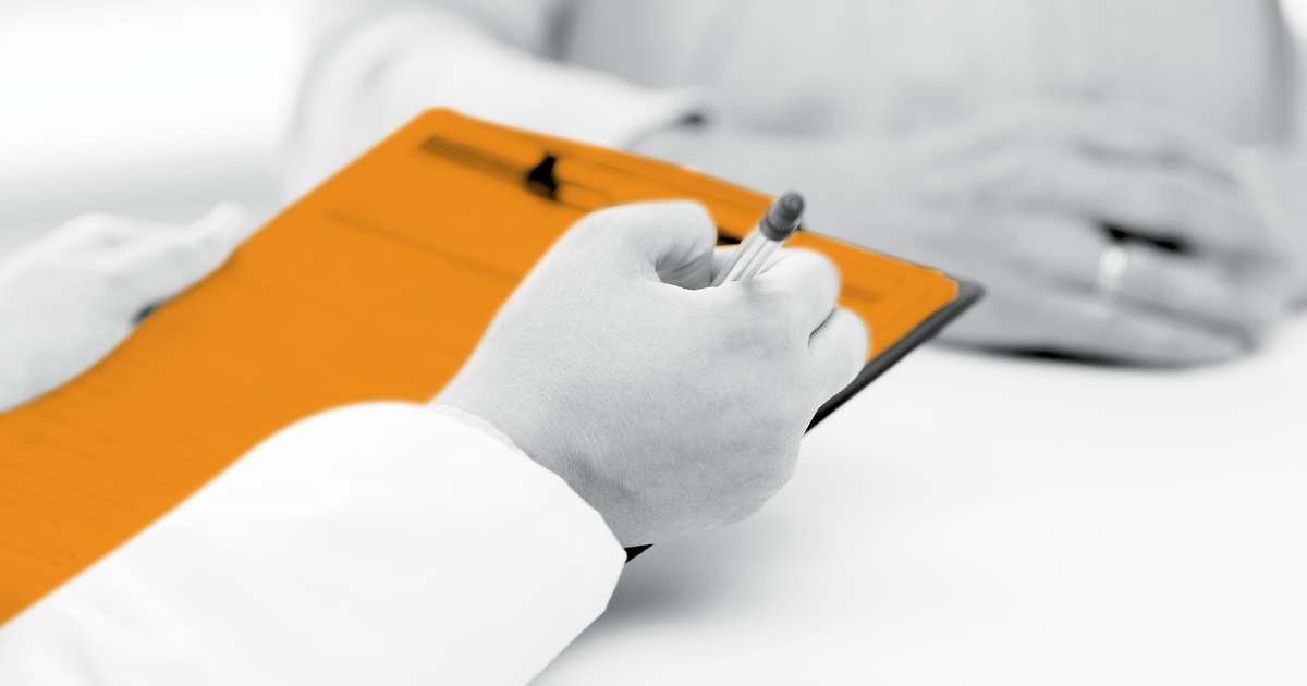 Image of patient completing a form.