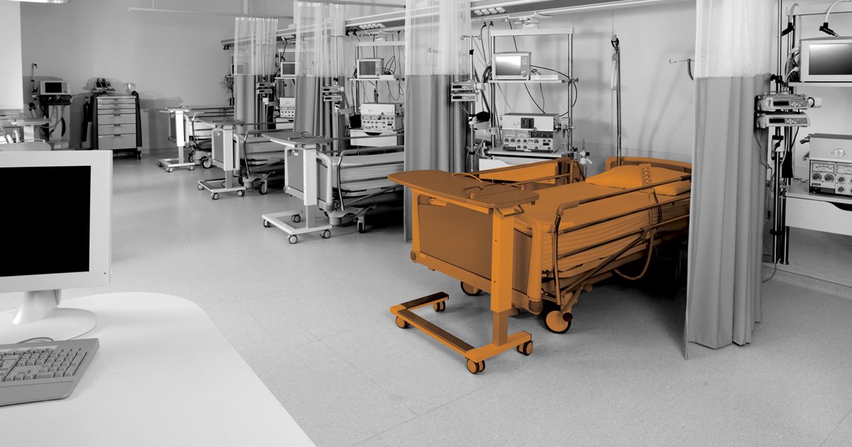 Image of hospital ward whit a bed hilighted in orange