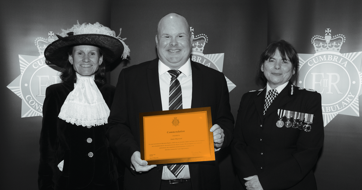 Image of Jamie Haywood receiving his comendation  