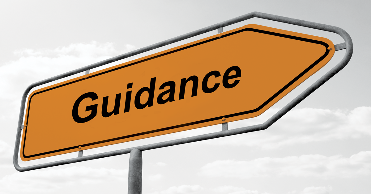 Image of an arrowed signpost showing the word Guidance