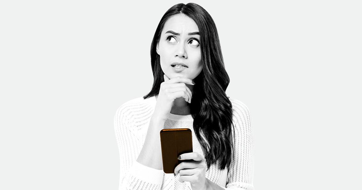 Image of a person holding a smart phone whilst being deep in thought.