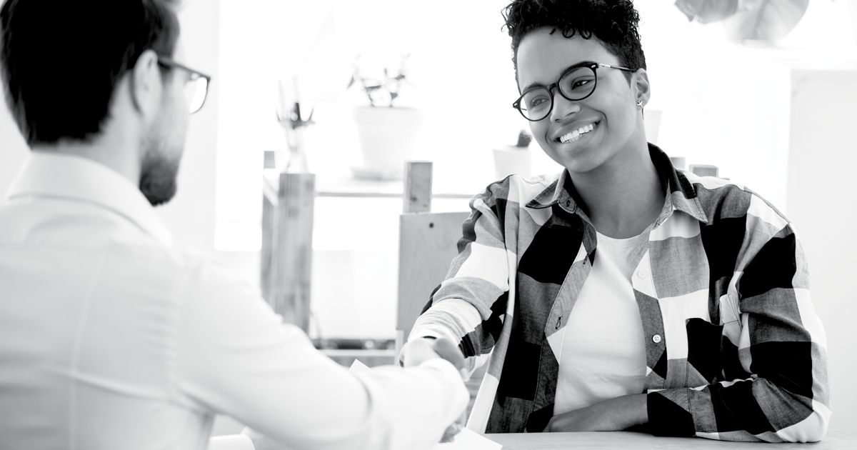 Image of two people shaking hands 